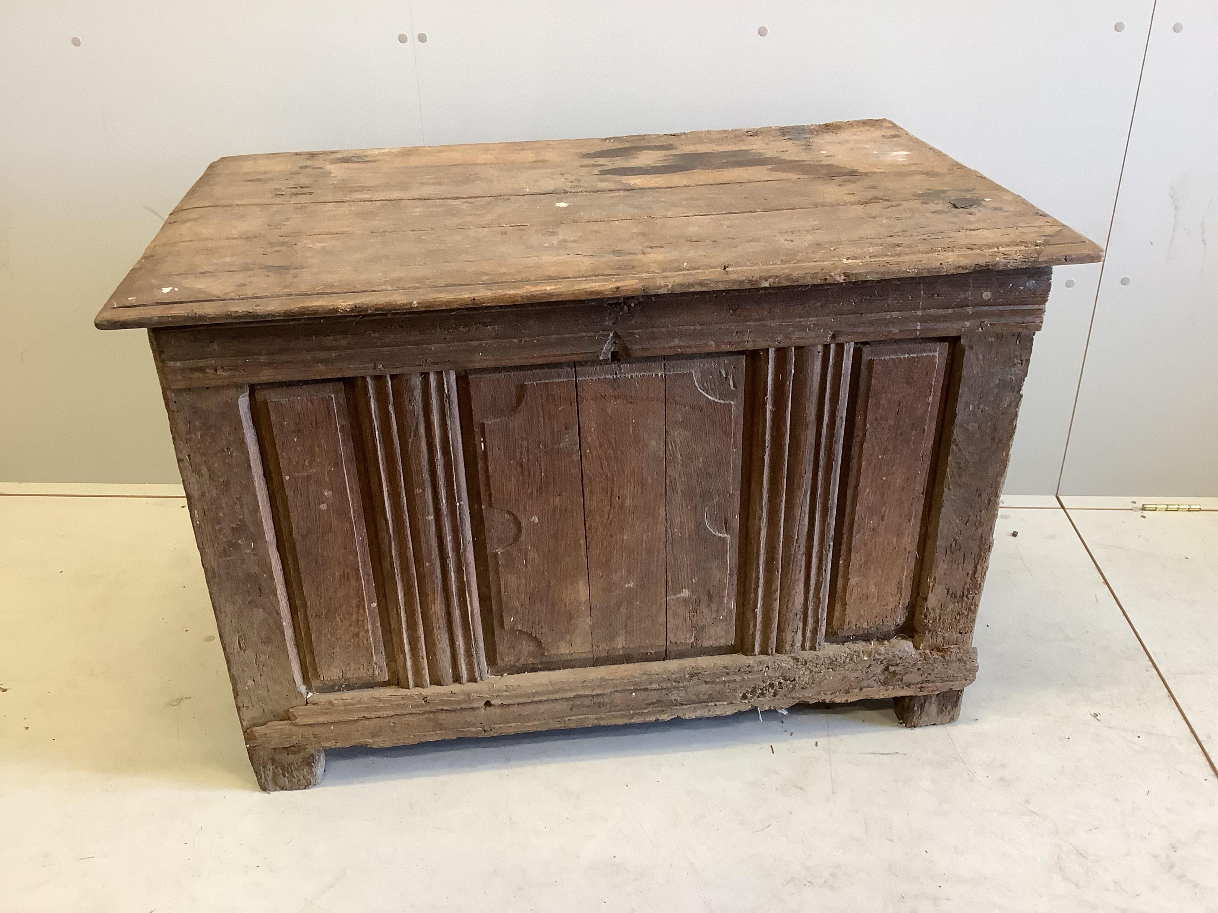 A 17th century style oak coffer (lid un-attached), width 111cm, depth 67cm, height 76cm